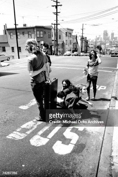 Phil Lesh, Bill Kreutzmann, Jerry Garcia, Bob Weir, Mickey Hart of the rock and roll band "The Grateful Dead" pose for a portrait in the middle of...