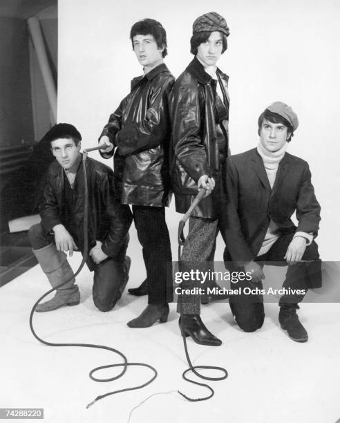 Mick Avory, Peter Quaife, Ray Davies, Dave Davies of the rock group "The Kinks" pose for a portrait session wearing black leather jackets in the...