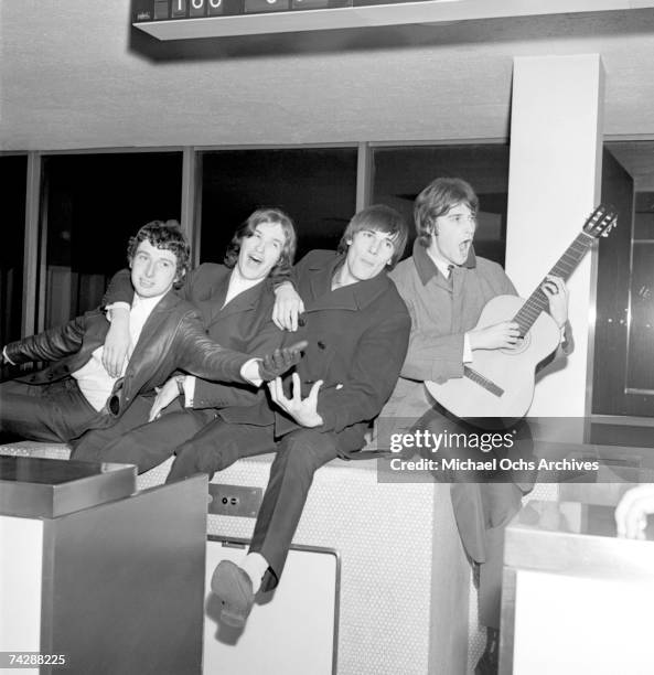 Mick Avory, Dave Davies, Peter Quaife, Ray Davies of the rock group "The Kinks" pose for a picture in the airport on their way to their first US tour...