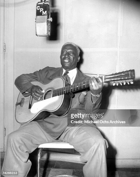 Folk and blues singer and guitarist Huddie Ledbetter aka Lead Belly or Leadbelly in the C.P. MacGregor studio circa 1944 in Los Angeles, California.