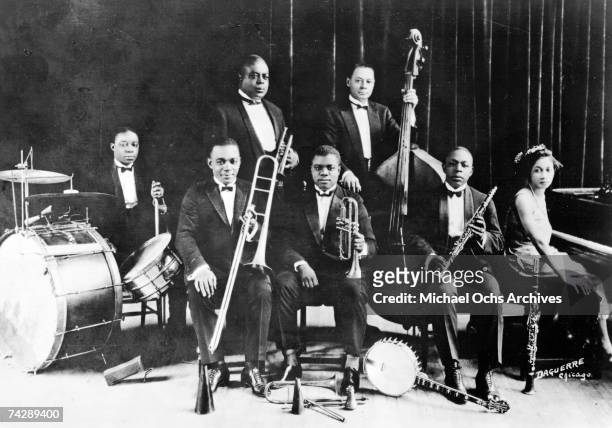 American jazz cornet player and bandleader King Oliver with Honoré Dutrey, Baby Dodds, Louis Armstrong, Lil Hardin Armstrong, Bill Johnson, Johnny...
