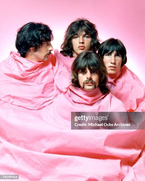 Psychedelic rock group Pink Floyd pose for a portrait shrouded in pink in August of 1968 in Los Angeles. Nick Mason, Dave Gilmour, Rick Wright ,...