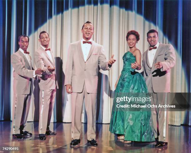 Herb Reed, Dave Lynch, Tony Williams, Zola Taylor and Paul Robi of the early rock and roll group "The Platters" perform onstage in a scene from the...