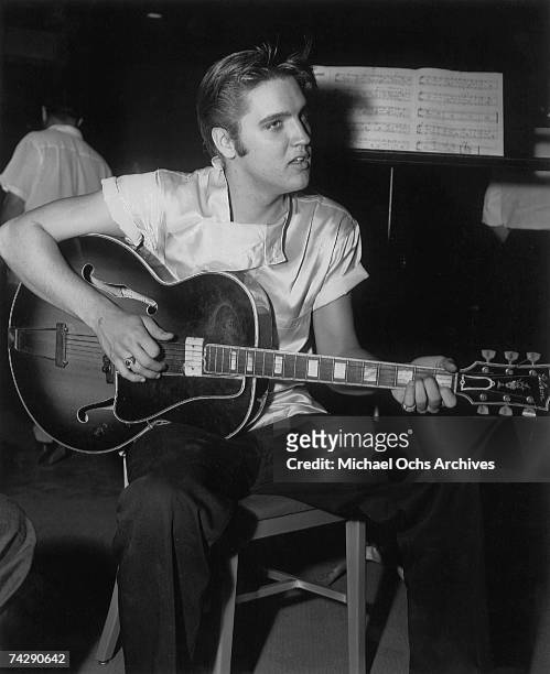 Rock and roll singer Elvis Presley records the soundtrack for his film "Love Me Tender" in RCA Studios on August 4, 1956 in Los Angeles, CA.