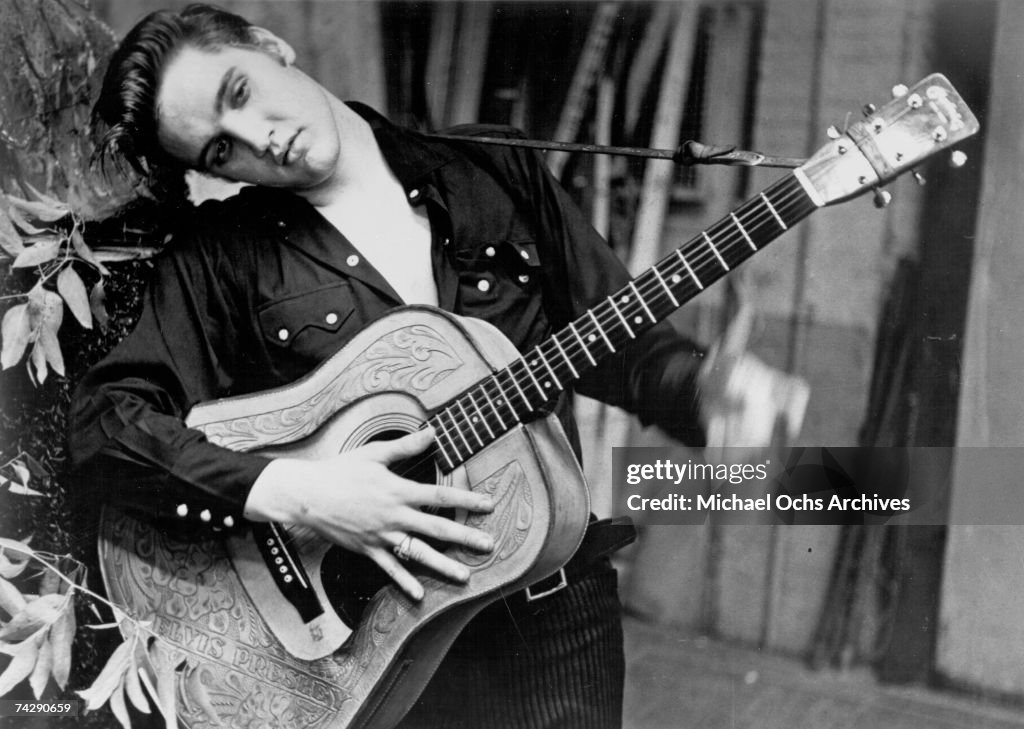 Elvis Presley portrait with an acoustic guitar