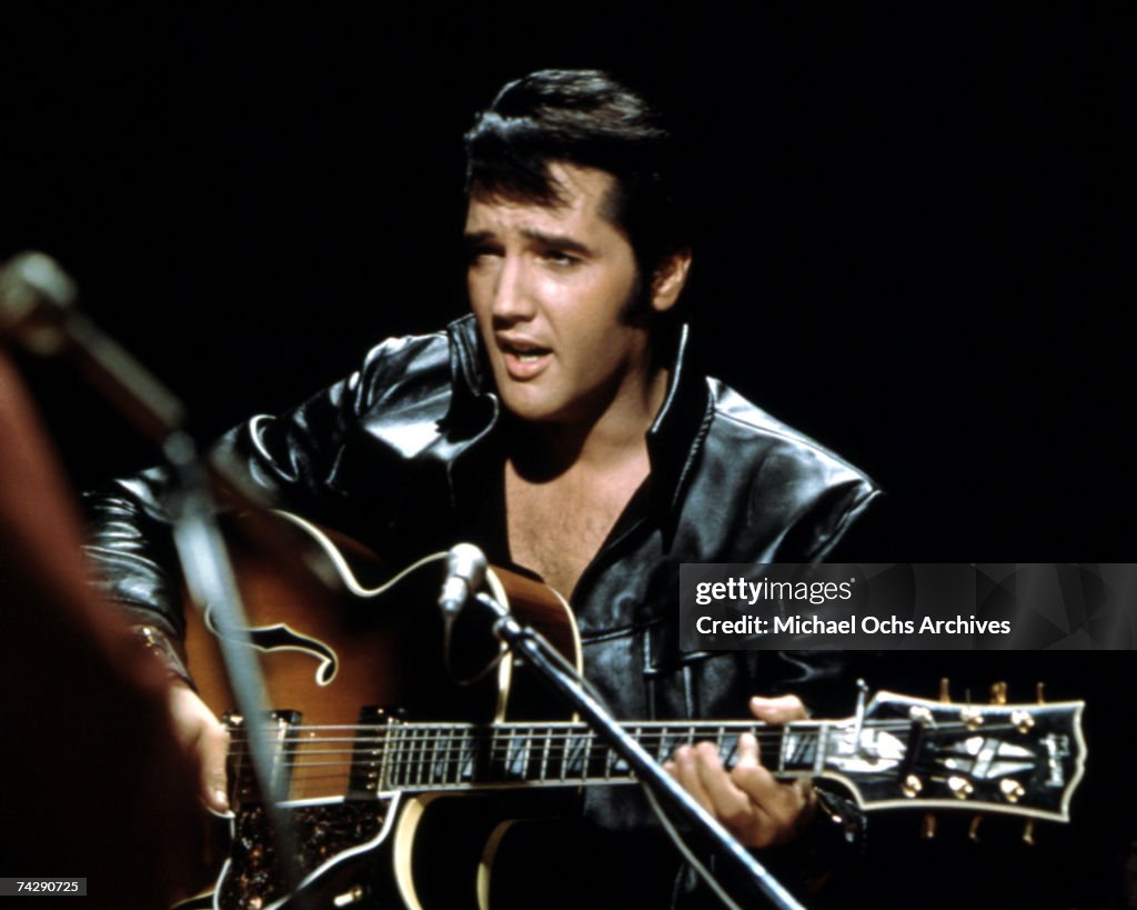 Rock and roll musician Elvis Presley performing...