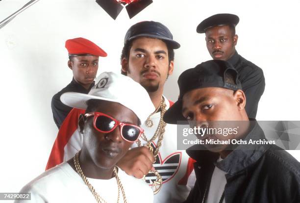 Flavor Flav, Professor Griff, Terminator X, S1W and Chuck D of the rap group Public Enemy pose for a portrait in a studio.