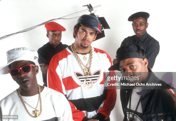 Flavor Flav, Professor Griff, Terminator X, S1W and Chuck D of the rap group Public Enemy pose for a portrait in a studio.