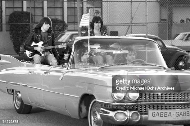 Left to right Johnny Ramone, Joey Ramone , Marky Ramone , Dee Dee Ramone , and driver Rodney Bingenheimer punk group The Ramones rides in a vintage...