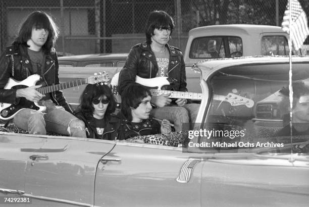 Left to right Johnny Ramone, Joey Ramone , Marky Ramone , Dee Dee Ramone , and driver Rodney Bingenheimer punk group The Ramones rides in a vintage...