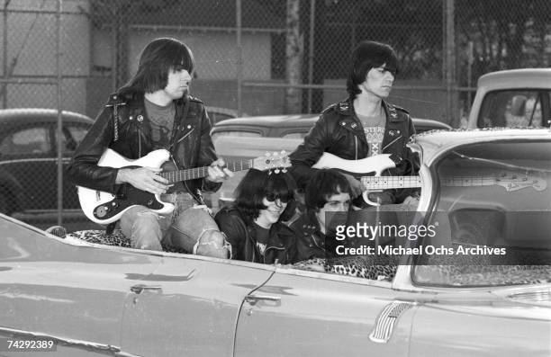 Left to right Johnny Ramone, Joey Ramone , Marky Ramone , Dee Dee Ramone , and driver Rodney Bingenheimer punk group The Ramones rides in a vintage...