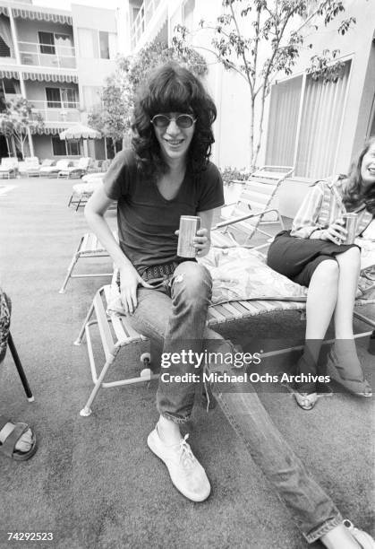 Singer Joey Ramone of the punk band "The Ramones" drinks a can of Michelob beer as he lounges poolside at a hotel in circa 1977 in Los Angeles,...