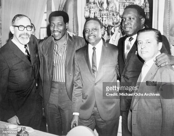 Jerry Wexler, Otis Redding, Eddie O'Jay, King Curtis and Nesuhi Ertegün pose for a portrait in 1966.