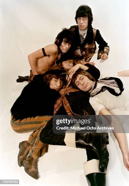 Rock and roll band 'The Rolling Stones' pose for a portrait lying down. Mick Jagger, Keith Richards, Bill Wyman, Charlie Watts, Brian Jones .