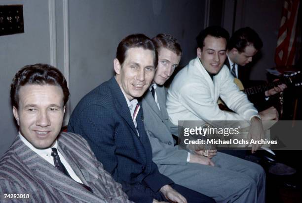 Country singers Marty Robbins, Chet Atkins, George Hamilton IV and pop singer Nick Todd pose backstage circa 1959 in Cleveland, Ohio.