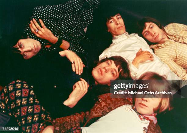Rock and roll band "The Rolling Stones" pose for a portrait lying down. Keith Richards, Bill Wyman, Charlie Watts, Brian Jones, Mick Jagger.