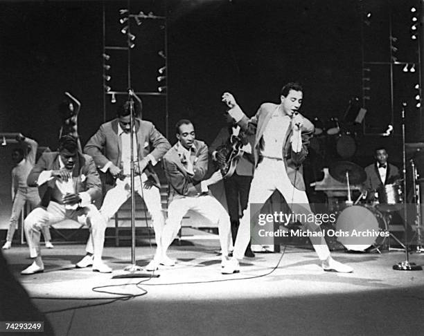 Motown group Smokey Robinson and the Miracles Gaye perform onstage during the concert movie "The T.A.M.I. Show" at the Santa Monica Civic Auditorium...