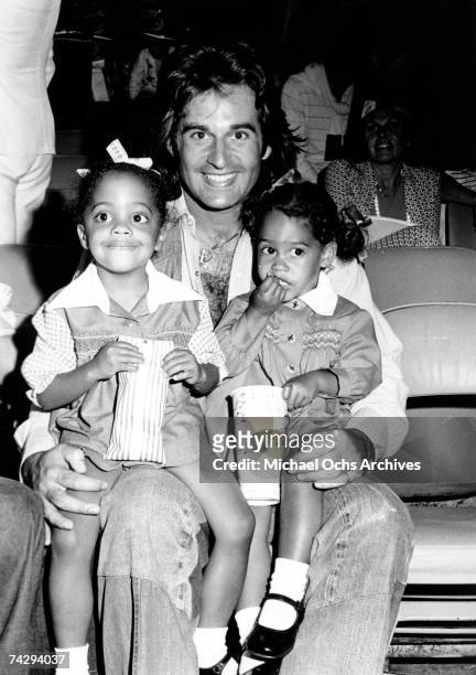 Robert Ellis Silberstein aka Bob Ellis attends a movie with daughters Rhonda Suzanne Silberstein and Tracee Joy Silberstein circa 1975 in Los...