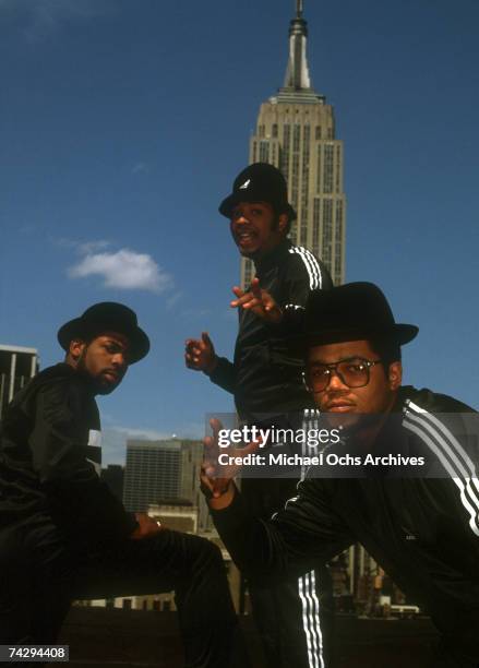 Joseph Simmons, Darryl McDaniels and Jam Master Jay of the hip-hop group "Run DMC" pose for a portrait session wearing Addidas sweat suits in front...