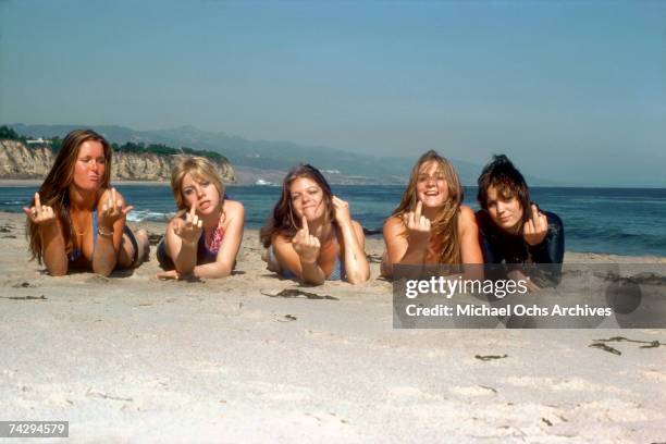 Rock band 'The Runaways' pose for a portrait on the beach in April of 1976. Lita Ford, Cherie Currie, Jackie Fox, Sandy West and Joan Jett.