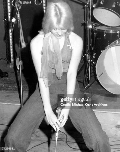 Singer Cherie Currie of the rock band "The Runaways" performs on stage in 1977.