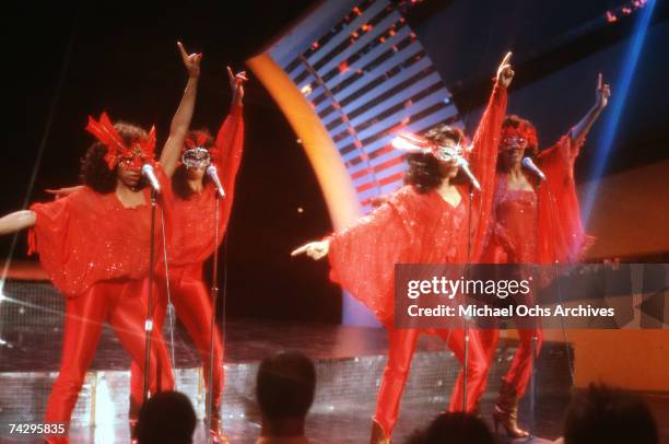 Kathy Sledge, Carol Sledge, Kim Sledge and Joni Sledge of vocal group, Sister Sledge, on stage, circa 1977.