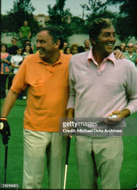 Pop singers and members of the "Rat Pack" Frank Sinatra and Dean Martin at a celebrity golf tournament in October 1971.