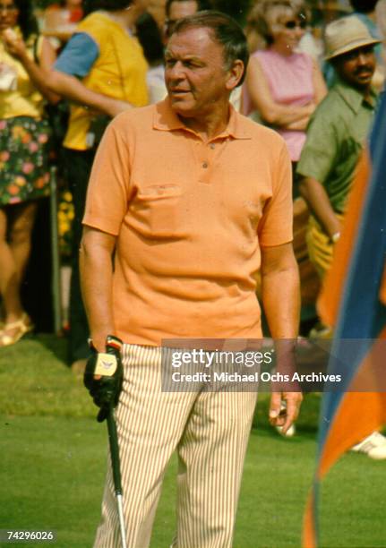 Pop singer Frank Sinatra plays golf at a celebrity golf tournament in October 1971.