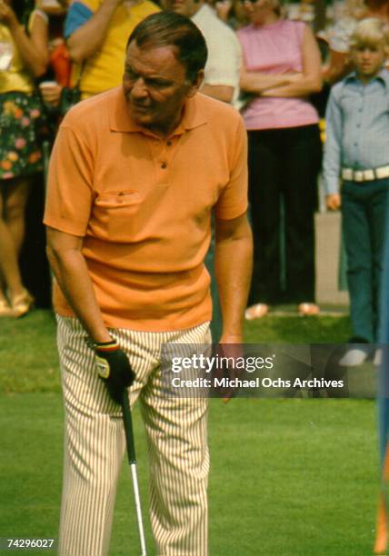 Pop singer Frank Sinatra plays golf at a celebrity golf tournament in October 1971.