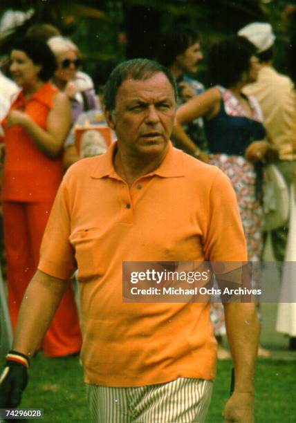 Pop singer Frank Sinatra plays golf at a celebrity golf tournament in October 1971.