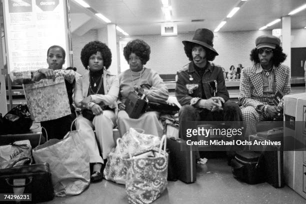 Singer Sly Stone of the psychedelic soul group "Sly & The Family Stone" awaits transportation with his actual family including his parents on August...