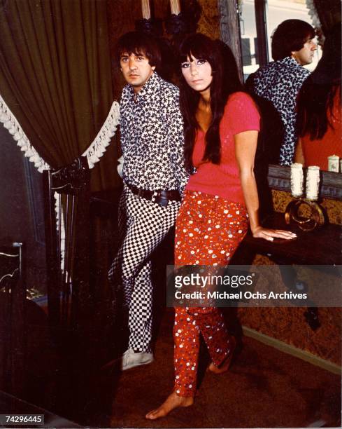 Entertainers Sonny Bono and Cher pose for a portrait session at home in April 1966 in Los Angeles, California.