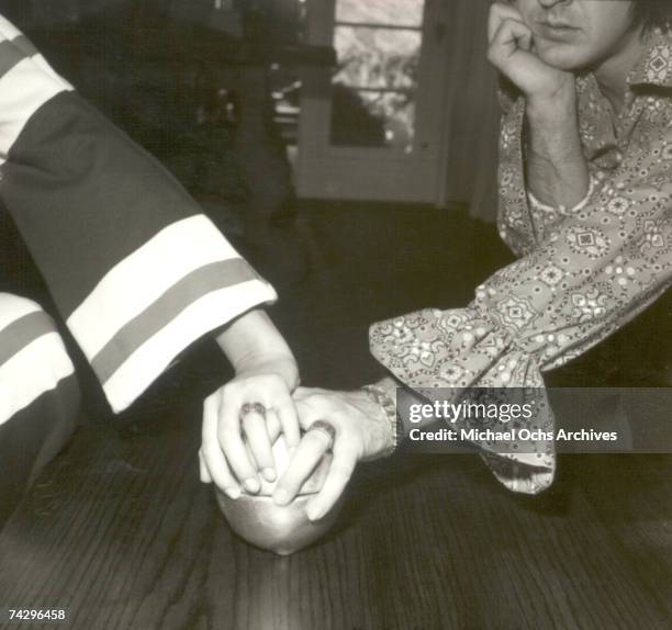 Entertainers Sonny Bono & Cher pose for a portrait session at home in 1965 in Los Angeles, California.