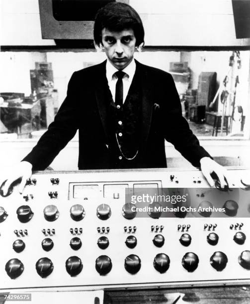 Producer Phil Spector poses at the mixing board during a recording session at Gold Star Studios in 1966 in Los Angeles, California.