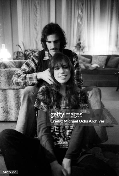 Singer/songwriter couple Carly Simon and James Taylor pose for a portrait session at the their home on October 13, 1971 in New York City, New York.