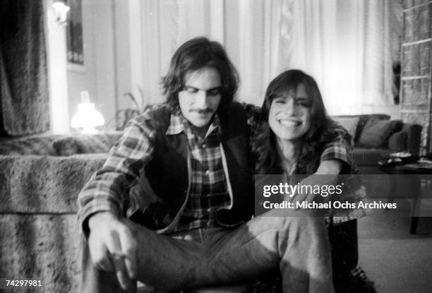 Singer/songwriter couple Carly Simon and James Taylor pose for a portrait session at the their home on October 13, 1971 in New York City, New York.