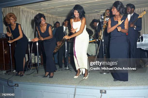 Husband-and-wife R&B duo Ike & Tina Turner perform onstage with a Fender Stratocaster electric guitar and the Ikettes in 1964 in Dallas Fort Worth,...
