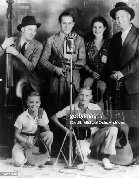 Country singer Johnnie Wright and the Tennessee Hillbillies (L-R Unidentified, Chet Atkins, Kitty Wells, and Johnnie Wright pose for a portrait circa...