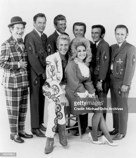 Country singers and collaborators Porter Wagoner and Dolly Parton pose for a portrait with their back up band, "The Wagonmasters", in circa 1968. Mr....