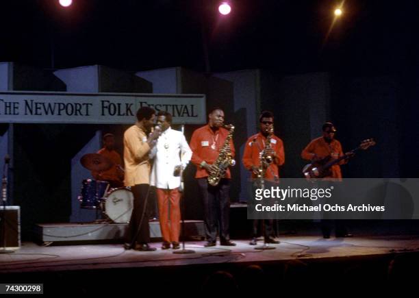 Buddy Guy and Junior Wells perform onstage at the Newport Folk Festival Fred Below , Buddy guy , Junior wells , A.C. Reed , Unidentified and Jack...