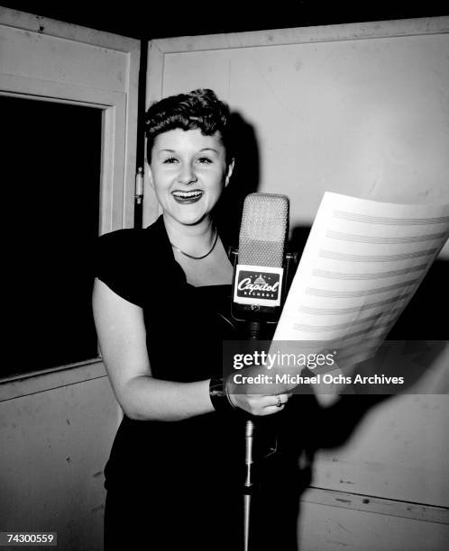 Singer Margaret Whiting sings at a recording session October 9, 1946 in the Capitol Records Studios in Los Angeles, California.