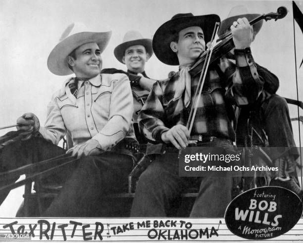 Lobby card for the 1940 Monogram Pictures film "Take Me Home to Oklahoma" starring Tex Ritter and Bob Wills. Photo by Michael Ochs Archives/Getty...