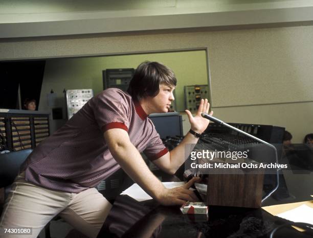 Singer and mastermind Brian Wilson of the rock and roll band "The Beach Boys" directs from the control room while recording the album "Pet Sounds" in...
