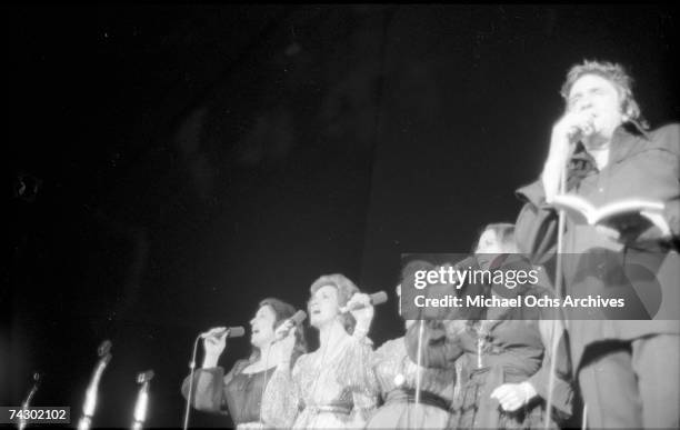 Country singer/songwriter Johnny Cash performs onstage with the Carter Sisters at the Anaheim Convention Center on March 11, 1978 in Anaheim,...