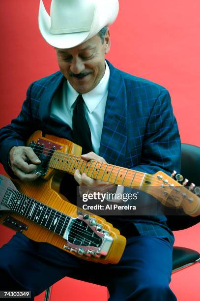 Musician Junior Brown poses for a portrait with his signature instrument, the "guit-steel" double neck guitar, a hybrid of electric guitar and lap...
