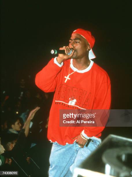 Rapper Tupac Shakur performs 'Out on Bail' onstage at the Paramount Theater during the first Source Awards on April 25, 1994 in New York City, New...