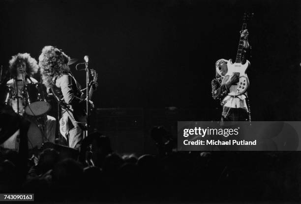 English rock group Slade performing on one of their two nights at the New Victoria Theatre, London, 25th-26th April 1975. Left to right: Don Powell,...