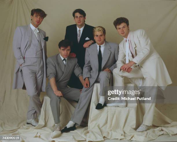 Studio portrait of English pop group Spandau Ballet, posed in London in May 1983. Left to right: bassist Martin Kemp, drummer John Keeble, singer...