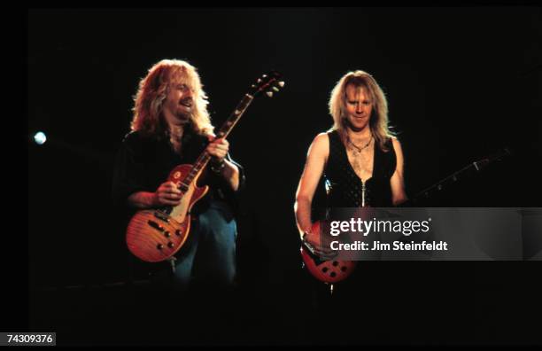 Guitarist Brad Whitford and bassist Tom Hamilton of the rock and roll band "Aerosmith" perform onstage in 1993 in Minnesota.