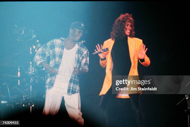 Singers and couple Bobby Brown and Whitney Houston perform onstage in 1989 in Minneapolis, Minnesota.